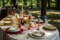 extensive collection of vintage linens, plates, and stemware for elegant picnic