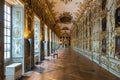 Beautifully decorated interior hallway with display of paintings