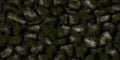 Extensive mossy stones surface. Cobble bowlders backdrop. Greenery boulder wall textures. Green cobblestones fence background Royalty Free Stock Photo