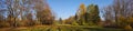 Diverse vegetation in the plant`s characteristic colors. Extensive panorama of the autumn park. Royalty Free Stock Photo
