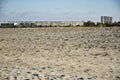 extensive sandy beach with holiday apartments and large Hotel on the horizon Royalty Free Stock Photo