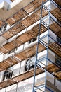Extensive scaffolding for building a new house. Constraction of platforms for building works Royalty Free Stock Photo