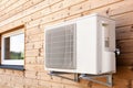 Exterior airconditioning unit on a wooden wall. Royalty Free Stock Photo