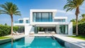 Exterior of amazing modern minimalist cubic villa with large swimming pool among palm trees Royalty Free Stock Photo