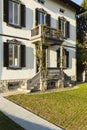 Exterior ancient villa with well-kept garden on a sunny day Royalty Free Stock Photo