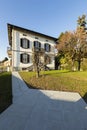 Exterior ancient villa with well-kept garden on a sunny day Royalty Free Stock Photo