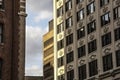 Exterior art deco pre-modern office building facade in city with decorative cartouche