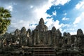 Exterior of the Bayon temple with gargantuan faces, Angkor Thom, Angkor, Cambodia Royalty Free Stock Photo