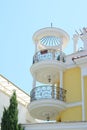 Exterior of beautiful building with balconies against blue sky, low angle view Royalty Free Stock Photo