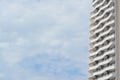 Exterior of beautiful building with balconies against blue sky, low angle view. Space for text Royalty Free Stock Photo