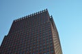 Exterior of beautiful modern building against blue sky, low angle view Royalty Free Stock Photo