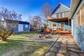 Exterior of blue craftsman house with covered back porch, fire p Royalty Free Stock Photo