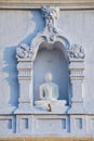 Exterior of the Buddha statue at Ruwanwelisaya stupa in Anuradhapura, Sri Lanka.