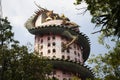 Exterior building with king of serpent naga and chinese dragon wrapped around tower for thai people travel visit and respect