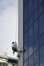 Exterior building maintenance worker. Royalty Free Stock Photo
