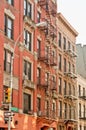 Exterior of a building with old fire escape in New York City Royalty Free Stock Photo