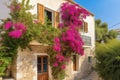 exterior of classic mediterranean house with lush bougainvillea climbing up the walls