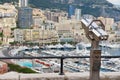 Exterior of the coin operated binocular at the viewpoint with the urban panorama at the background in Monaco. Royalty Free Stock Photo