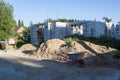 exterior of a country house under construction. Site on which th