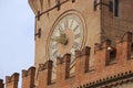 Exterior detail of the Clock Tower at Palazzo Comunale in Bologna, Italy. Royalty Free Stock Photo