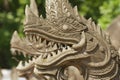 Exterior detail of the Naga (giant snake), protecting the Haw Phra Kaew temple in Vientiane, Laos. Royalty Free Stock Photo