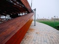 Exterior details of a city concert hall made from wood, stone and metal material. Nobody. Mist in the background. Modern design Royalty Free Stock Photo