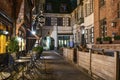 Exterior of a european restaurant in the narrow street at night