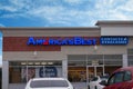 The exterior facade of an America`s Best discount eyeglass store on a clear, sunny day