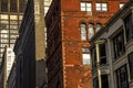 Exterior facade of pre-modern 1900`s architectural style commercial office business buildings in downtown city, brick, stone, bay