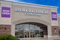 The exterior facade of a Raymour & Flanigan Furniture store on a clear sunny day