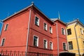 Exterior facade of the red house. Urban vintage background.Bright facades