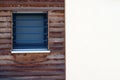 Square window in the wooden panel Royalty Free Stock Photo
