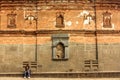 The exterior facade of a wall in the ancient ruins of the Adina Masjid mosque in the