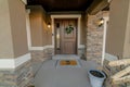 Exterior of a front door of a house with brown and white outline colors