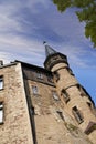 Exterior of a gothic victorian building in the style of England Gothic Revival on a cloudy blue sky with copy space. Low Royalty Free Stock Photo