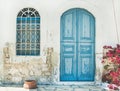 Exterior of Greek island traditional street with blue door, Kast Royalty Free Stock Photo
