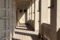 Exterior hallway of Christian church with sunlight, shadow