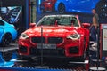 Exterior, headlights, hood and grill of red BMW M2