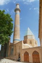 Exterior of the historical Natanz mosque with elaborately decorated minaret in Natanz, Iran.
