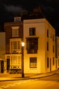 the exterior of a home from the 1700's lit by a street lamp in Old portsmouth, Portsmouth, UK