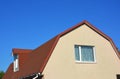 Exterior House Attic Dormer Window and Roofing Construction. Royalty Free Stock Photo