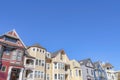 Exterior of houses with colorful sidings in a row against the clear sky background Royalty Free Stock Photo