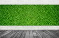 Empty space room of Green artificial grass with white brick wall and wooden floor. Royalty Free Stock Photo