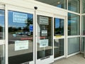 The exterior of a Kohl`s department store with signs warning that one of the entrances is closed due to coronavirus Royalty Free Stock Photo