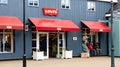 Exterior landscape view of the Levi store front, sign and awnings at the factory outlets at Caledonia Park, Glasgow Road, Gretna.