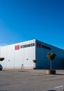 Exterior of a large DB Schenker warehouse..