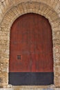 Exterior of Large Old Wooden Arched Door in Spain Royalty Free Stock Photo