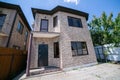 Exterior of a large two story brick residential home containing plenty of copy space Royalty Free Stock Photo