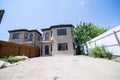 Exterior of a large two story brick residential home containing plenty of copy space Royalty Free Stock Photo