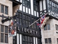 Exterior of the Liberty of London luxury store on Regent Street in the West End of London, UK with the union jack flag flying.